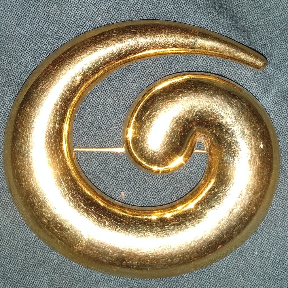 Monet Vintage gold costume jewelry pin.